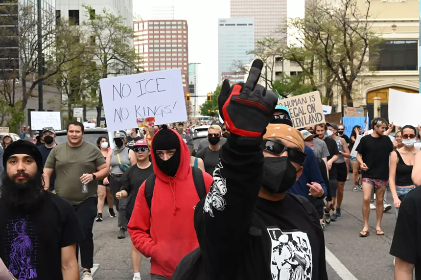 A man raises his middle finger.