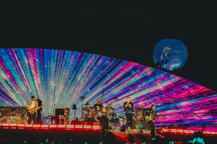Coldplay on stage at Empower Field at Mile High.