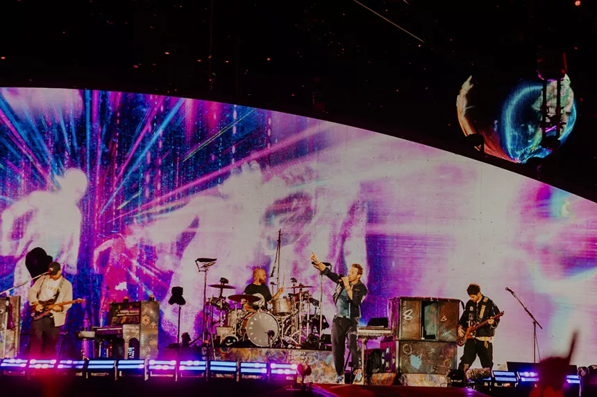 Coldplay on stage at Empower Field at Mile High.