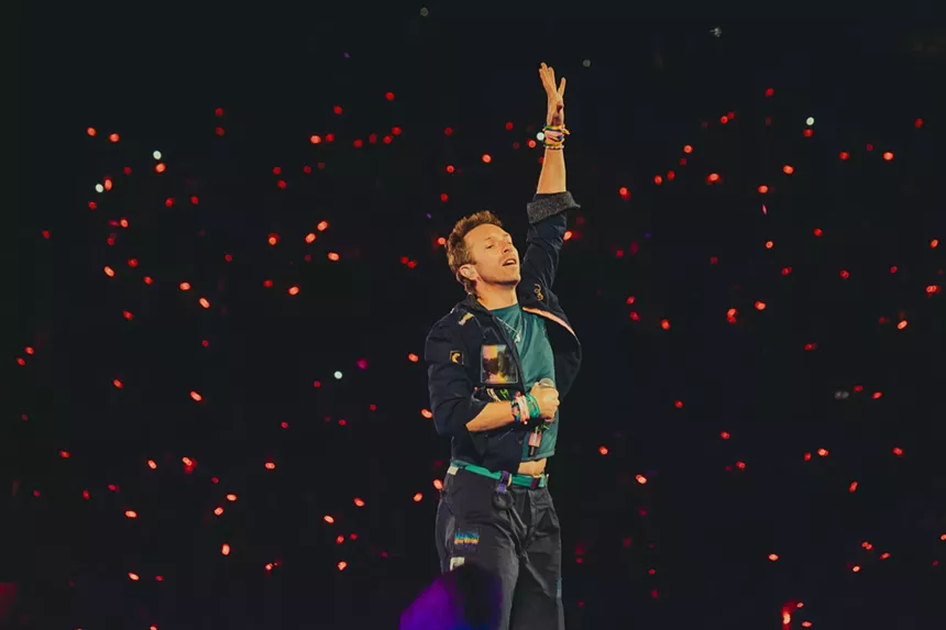 Chris Martin, lead singer of Coldplay, on stage at Empower Field at Mile High.