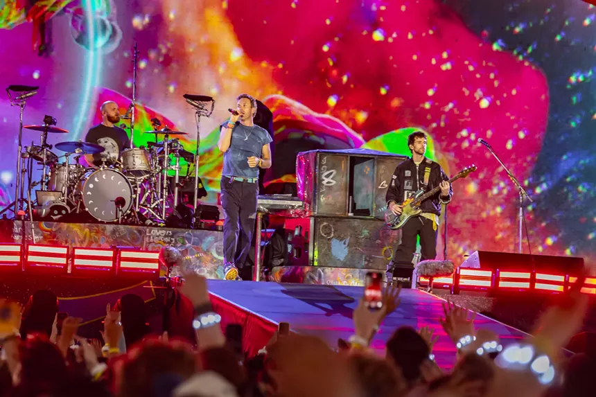 Coldplay on stage at Empower Field at Mile High.