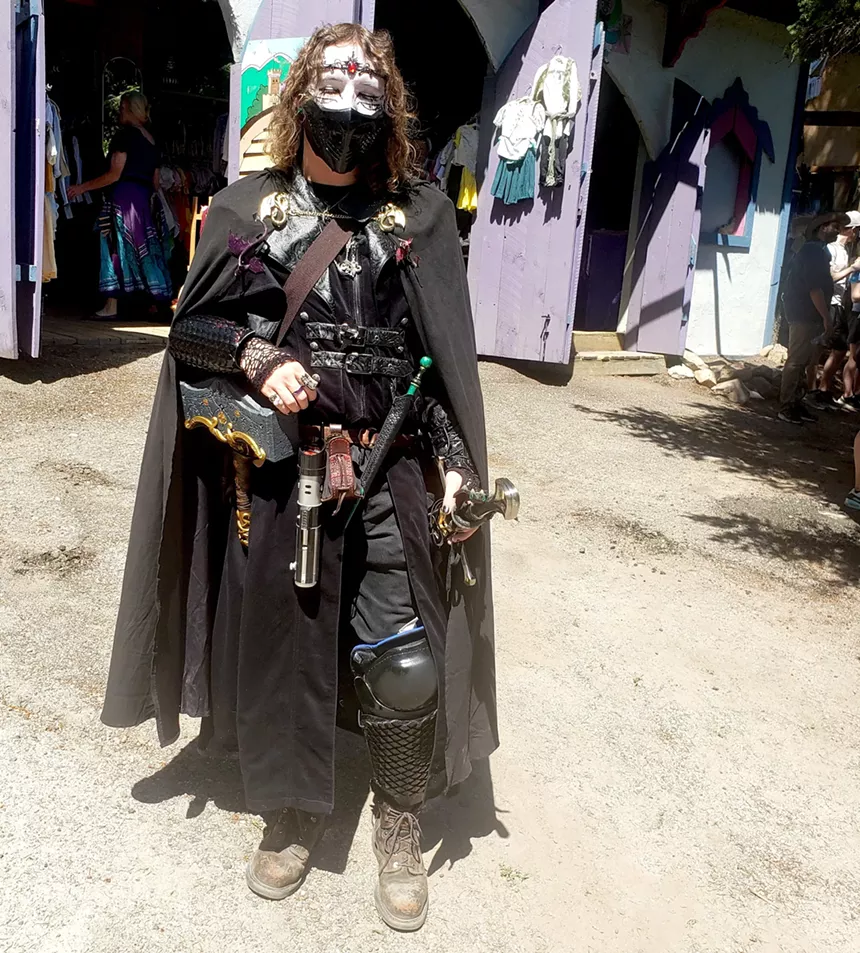 A person in Renaissance Festival clothes.