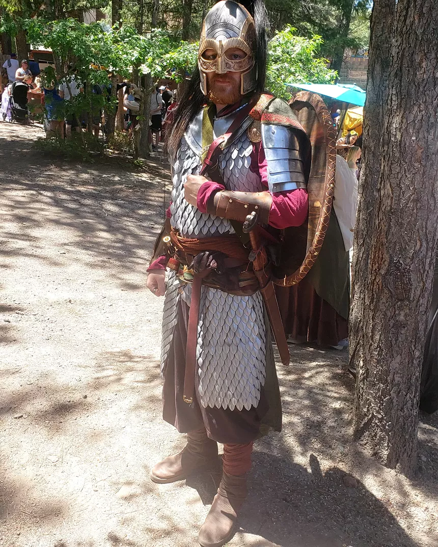 A person in Renaissance Festival clothes.
