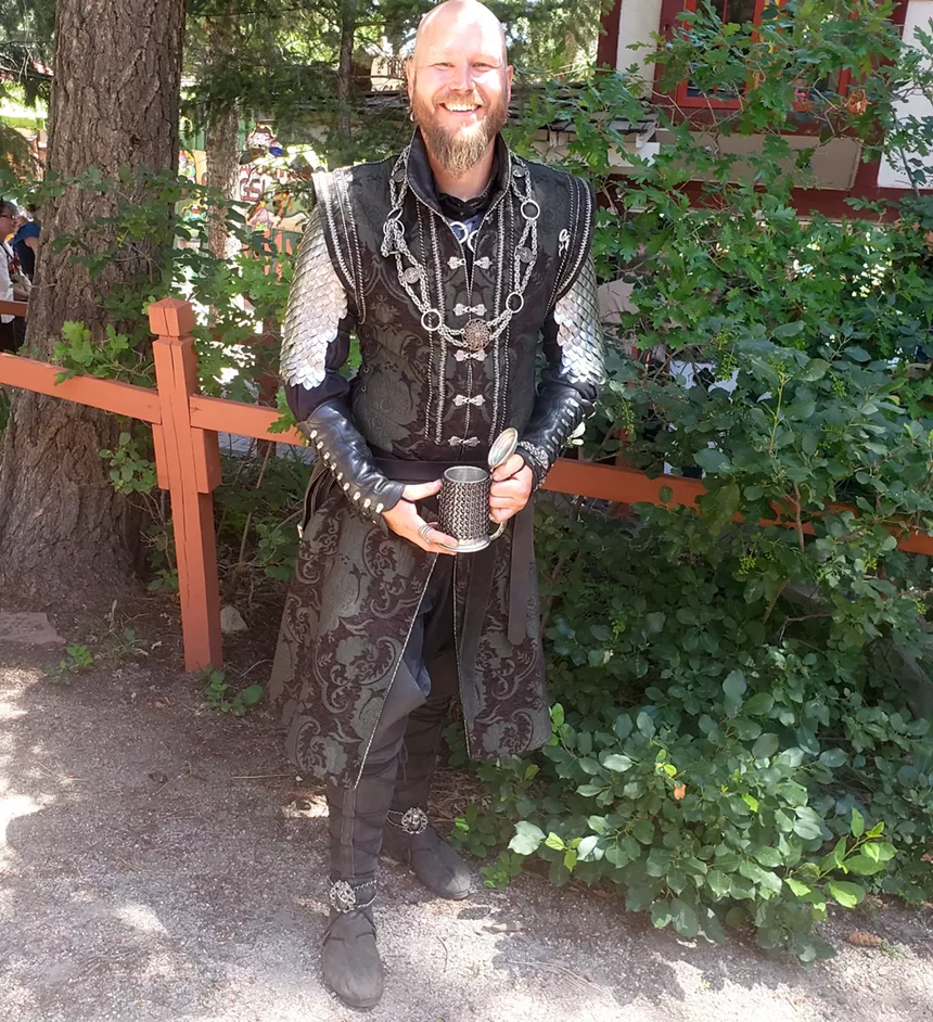 A person in Renaissance Festival clothes.