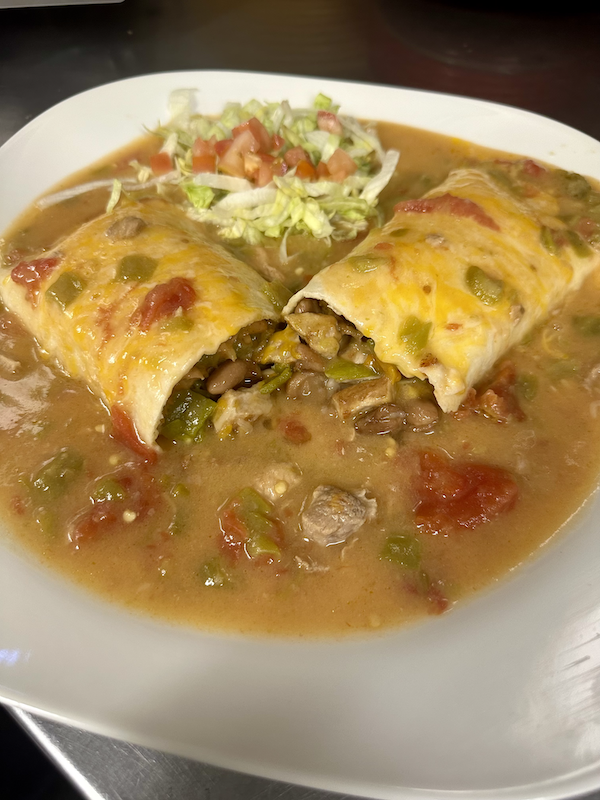 Freshly grilled diced prok, whole beans, green chile strips, and cheese, all smothered in housemade green chile.