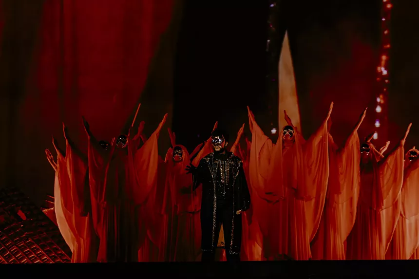 The Weeknd with dancers on stage at Empower Field at Mile High for his After Hours Til Dawn Tour on Saturday, June 21.