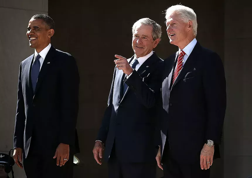 barack obama, george w. bush and bill clinton stand in suits