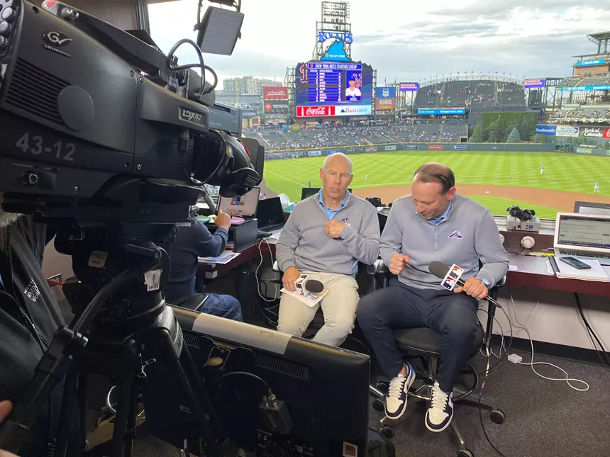 Rockies play by play crew talks in front of camera
