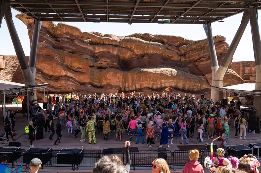 People dance at Red Rocks.