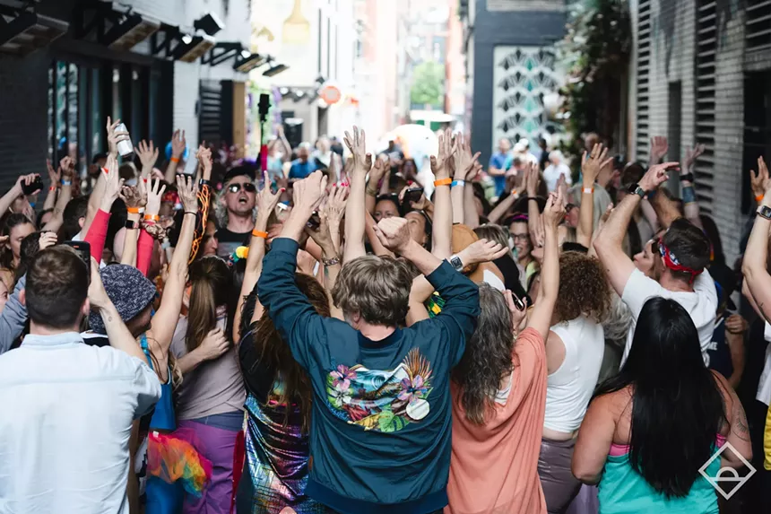 People dance outside.