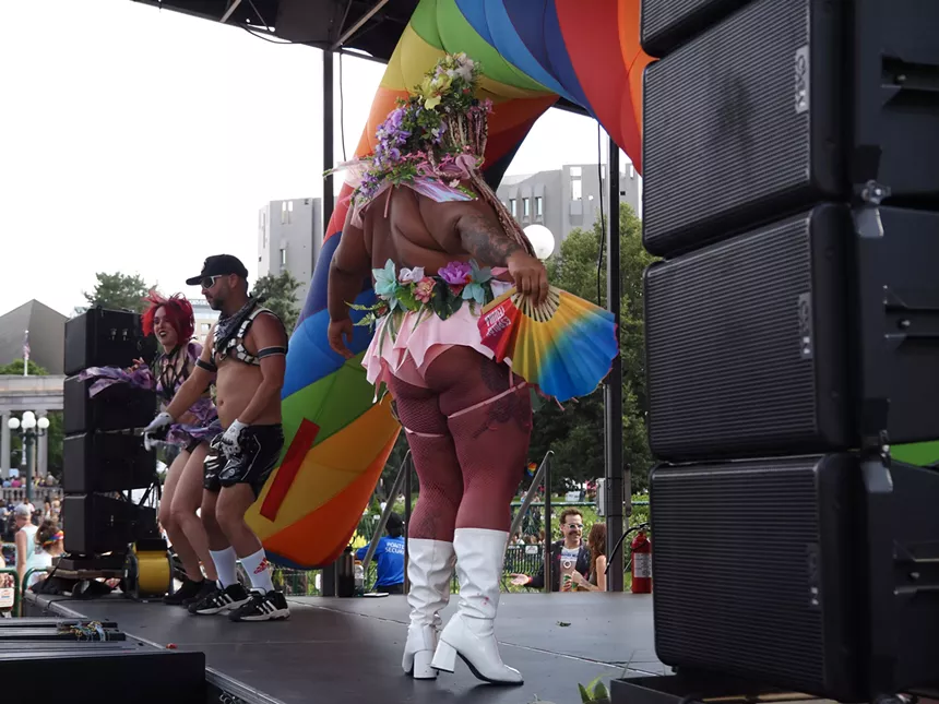 Performers dance on stage