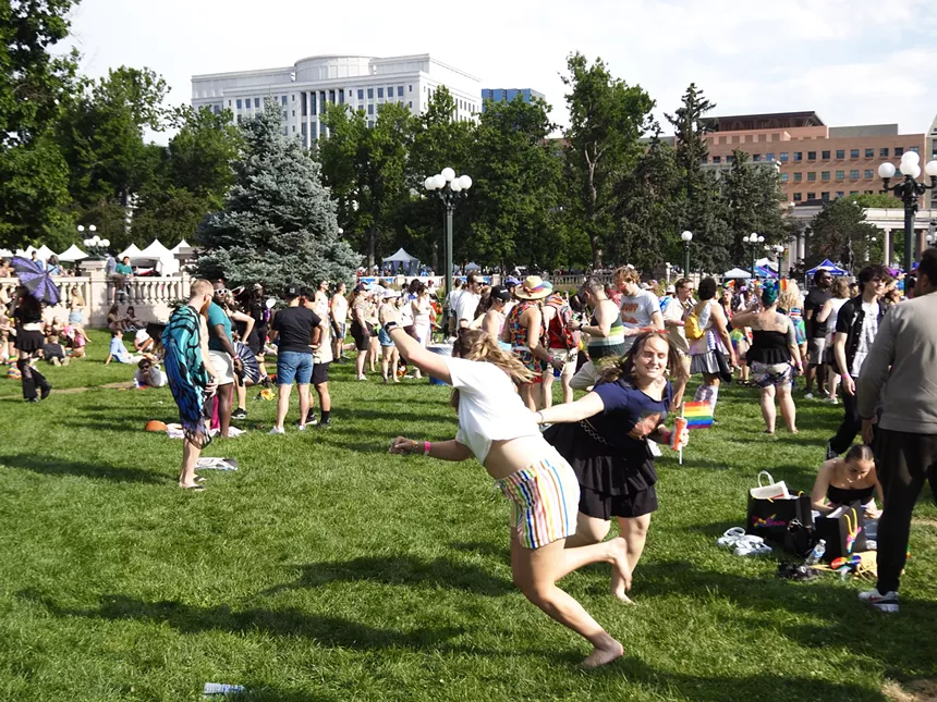 People play in the grass