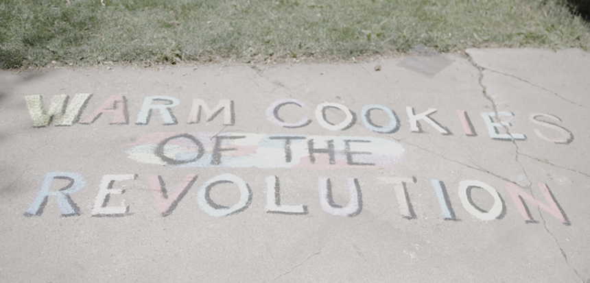 A chalk drawing that says "Warm Cookies of the Revolution."