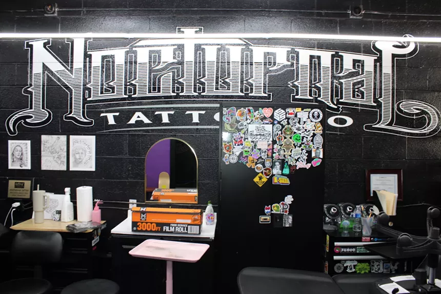 Inside a tattoo shop.