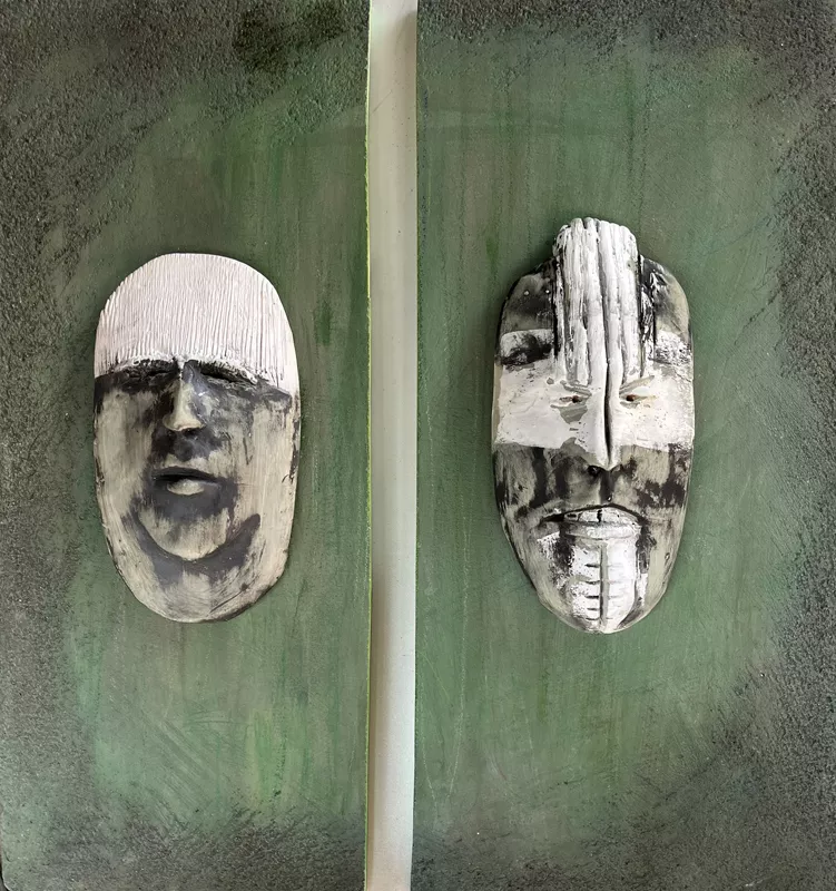 two heads on a green background