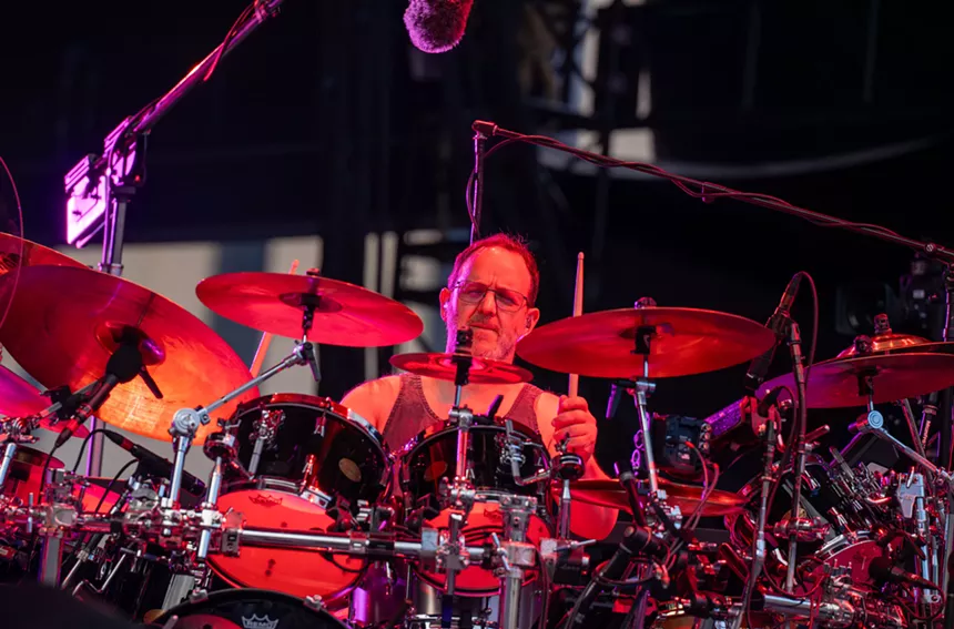 John Fishman playing drums