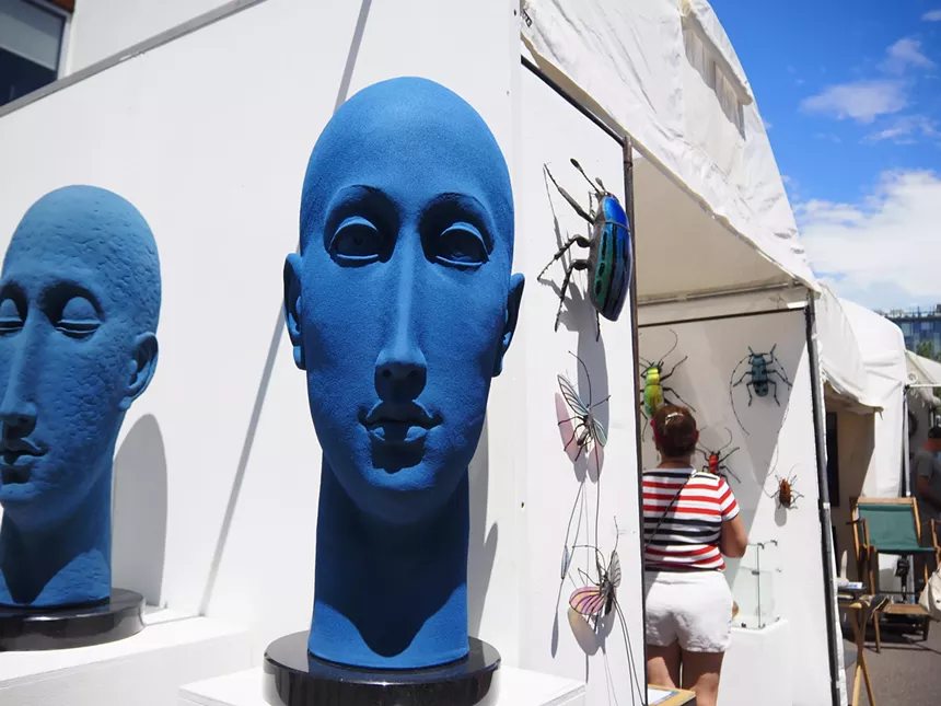 A large blue sculpture of a head