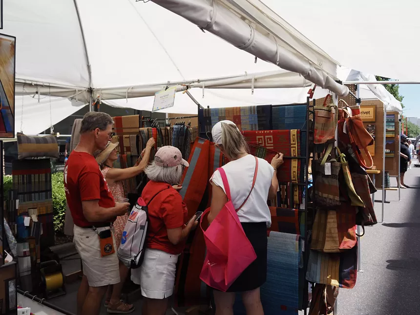 people browse colorful textile art
