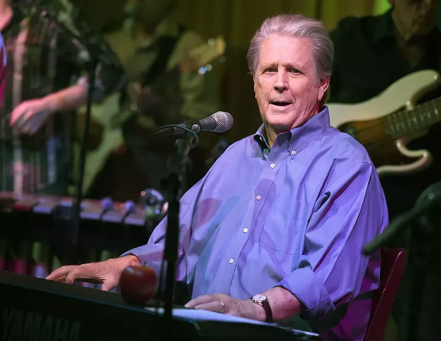 musician in blue shirt