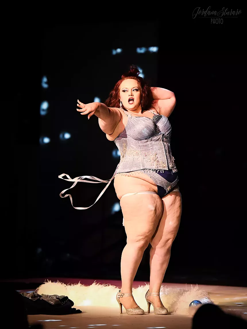 Burlesque performer onstage.