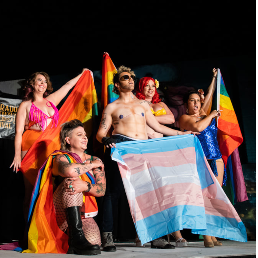Burlesque performers appear onstage.