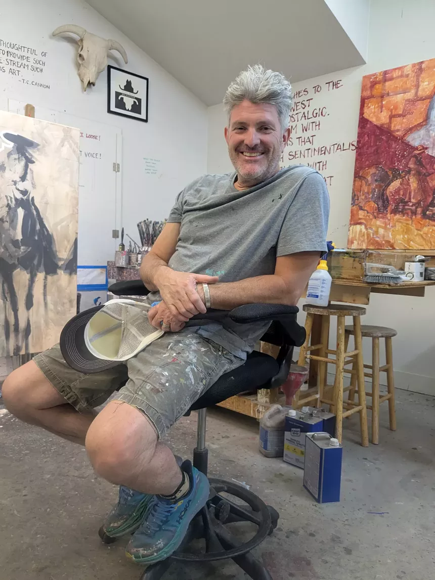 A man sits in a chair
