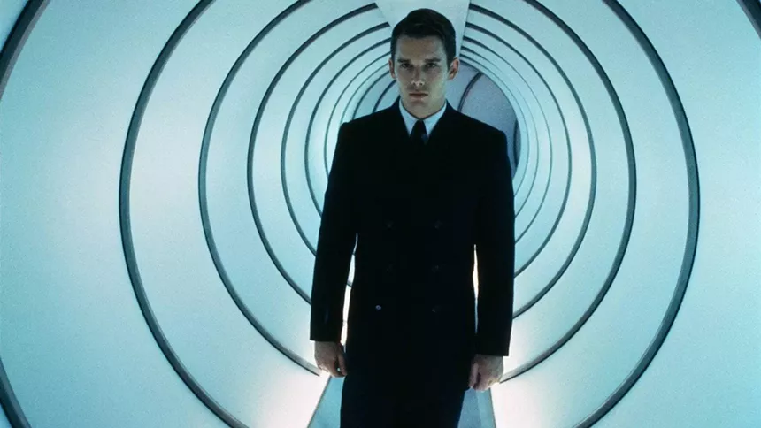 A man in a suit in a white tunnel