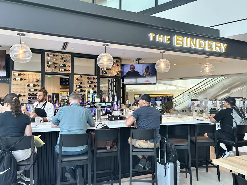 People seated at The Bindery's new airport bar