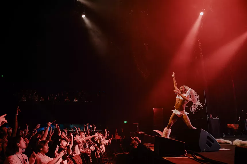 pop artist dancing on stage in front of an audience