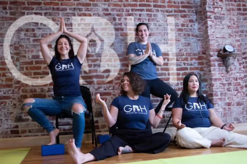People strike yoga poses