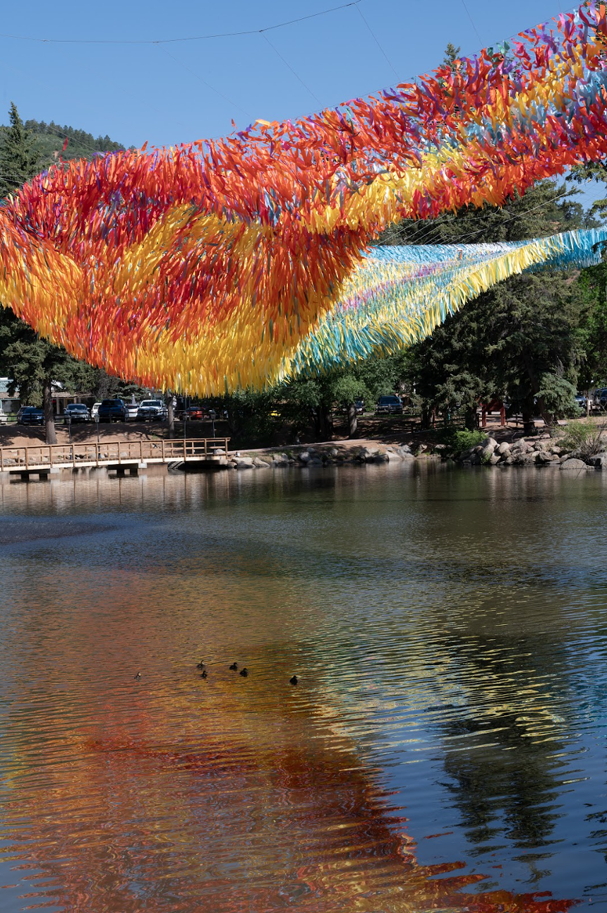 Colorful streamers over a body of water
