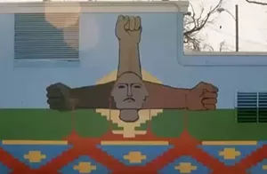 A colorful mural of fists