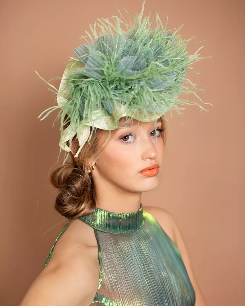a woman wearing a green hat