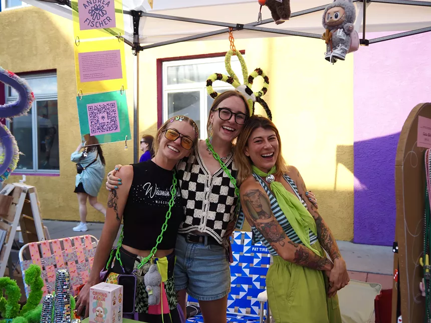 Three women pose for a picture
