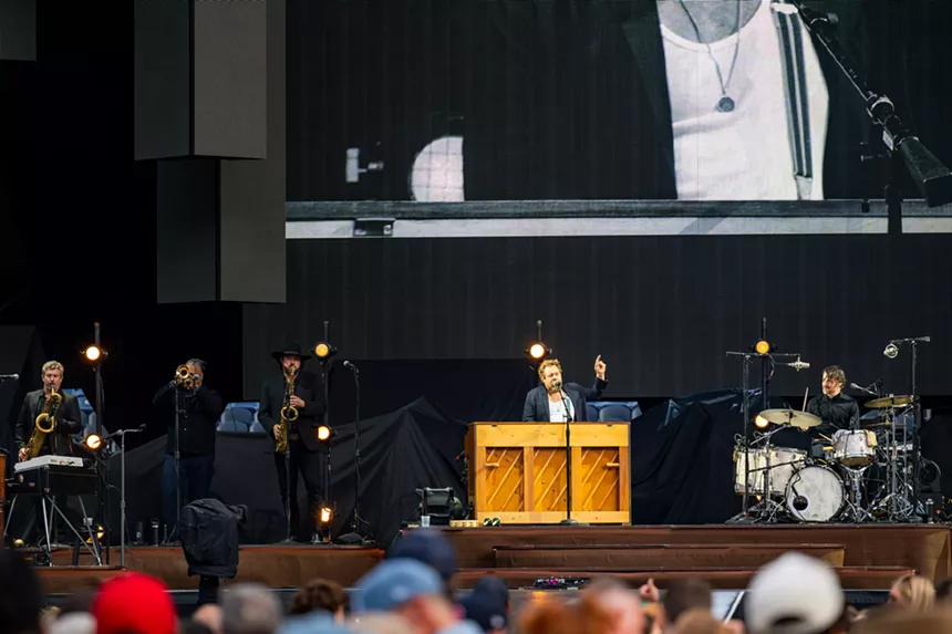 Nathaniel Rateliff on stage at Empower Field
