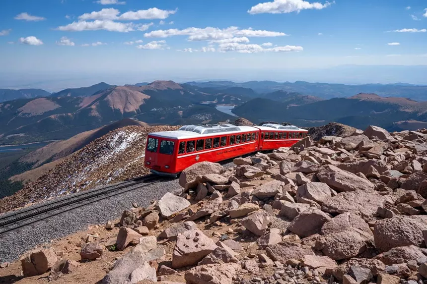 The Broadmoor Manitou and Pikes Peak Cog Railway train traveling to the rocky summit