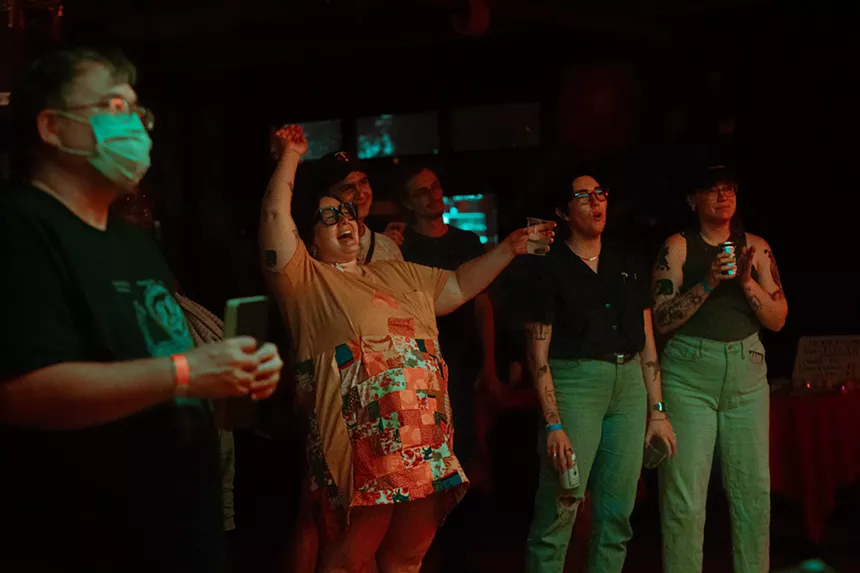 people in an audience smiling