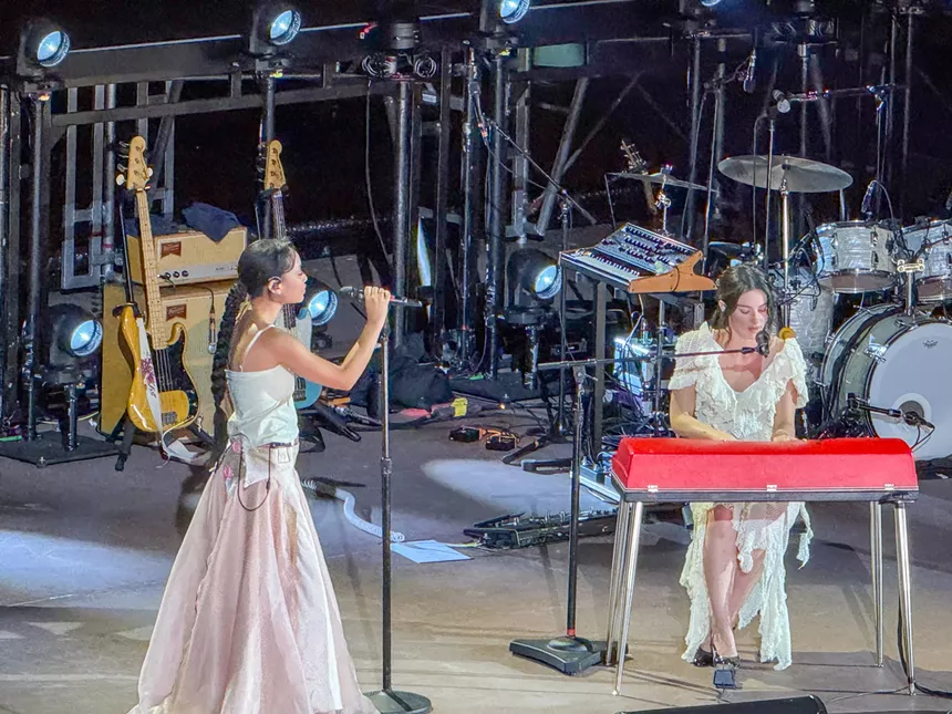 Griff and Gracie Abrams performing on stage.