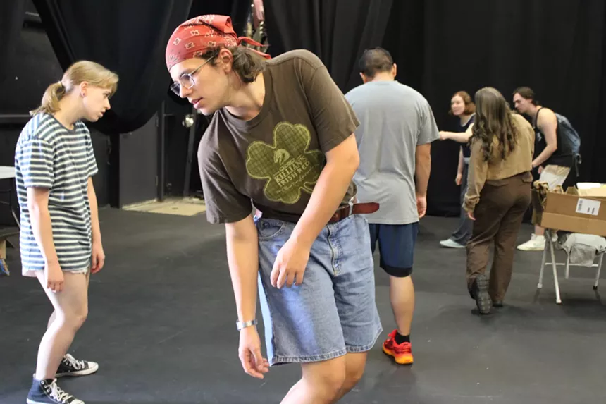Actors rehearse a zombie play.