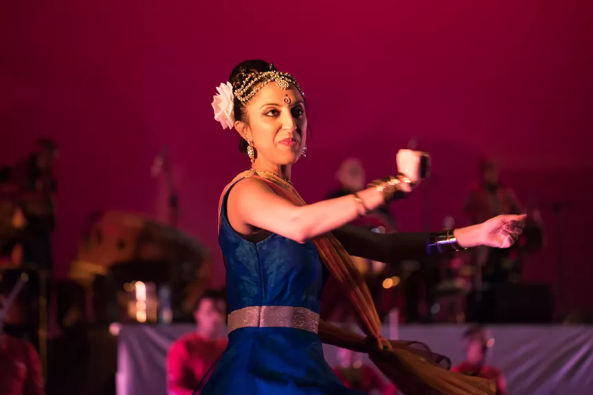A dancer performs onstage.