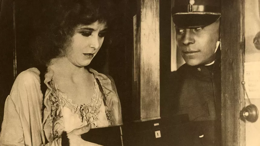A black and white photo of a man and woman