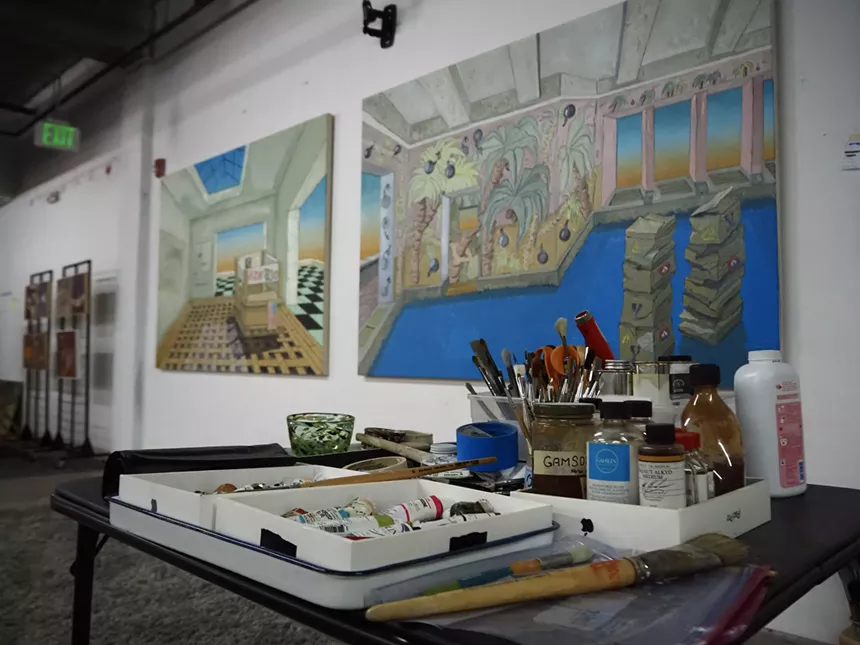 paint brushes and paintings