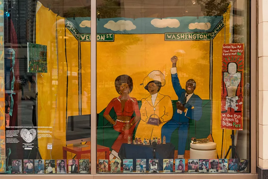 A yellow mural of people
