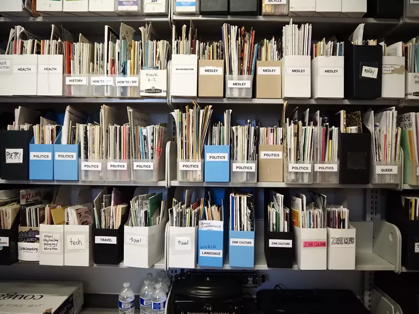 shelves of zines