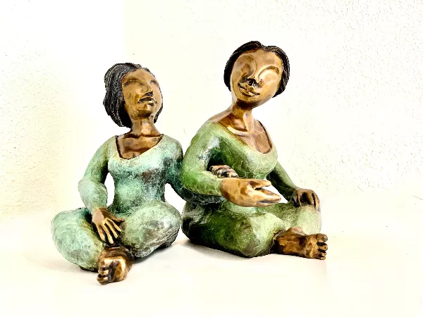 clay figures of two women