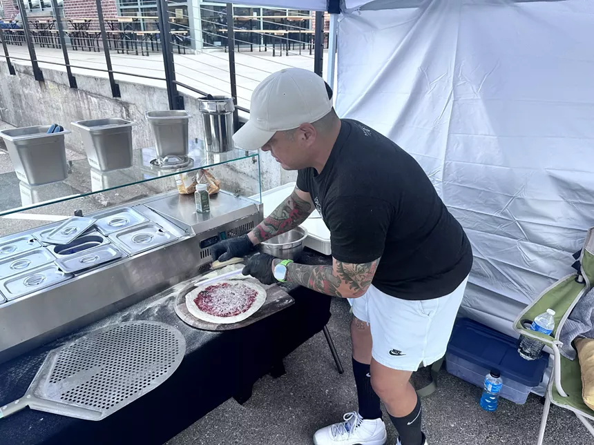 man making a pizza