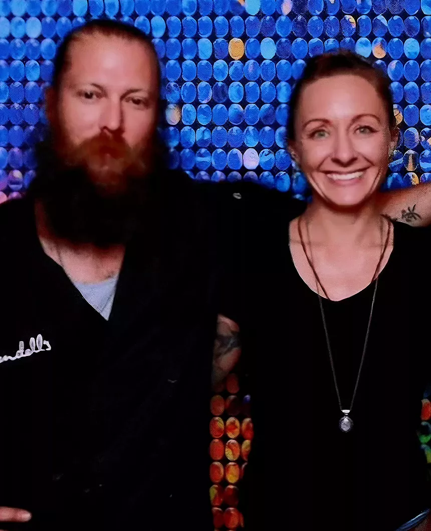 a man and a woman posing