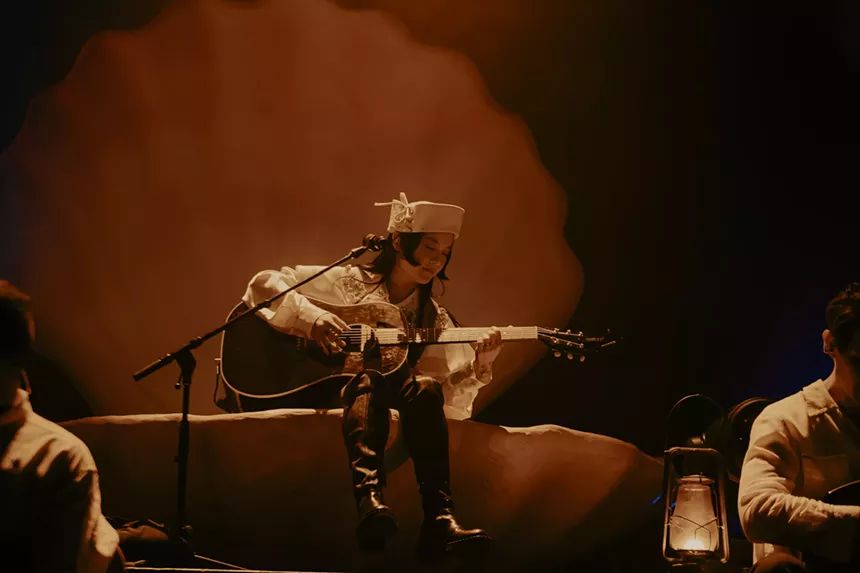 Japanese Breakfast plays the guitar as she opens her set at the Mission Ballroom for her Melancholy Tour.