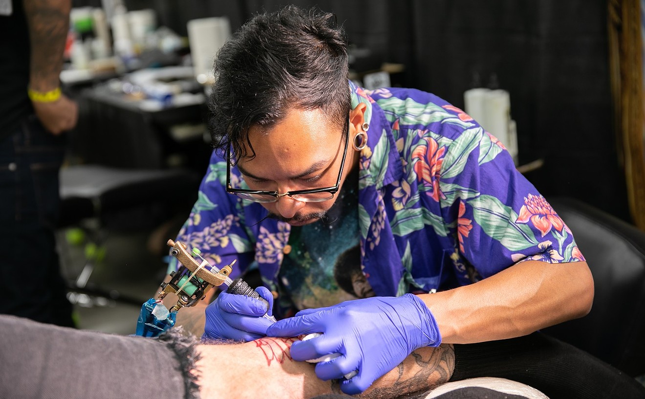 Norman Demorte, of Sincerely Tattoo, busy at work.