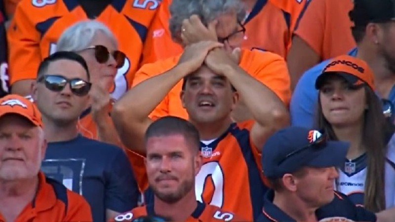 A Broncos fan at the September 18 game against the Houston Texans reacting to Nathaniel Hackett burning the team's final time out with seven minutes left to play.